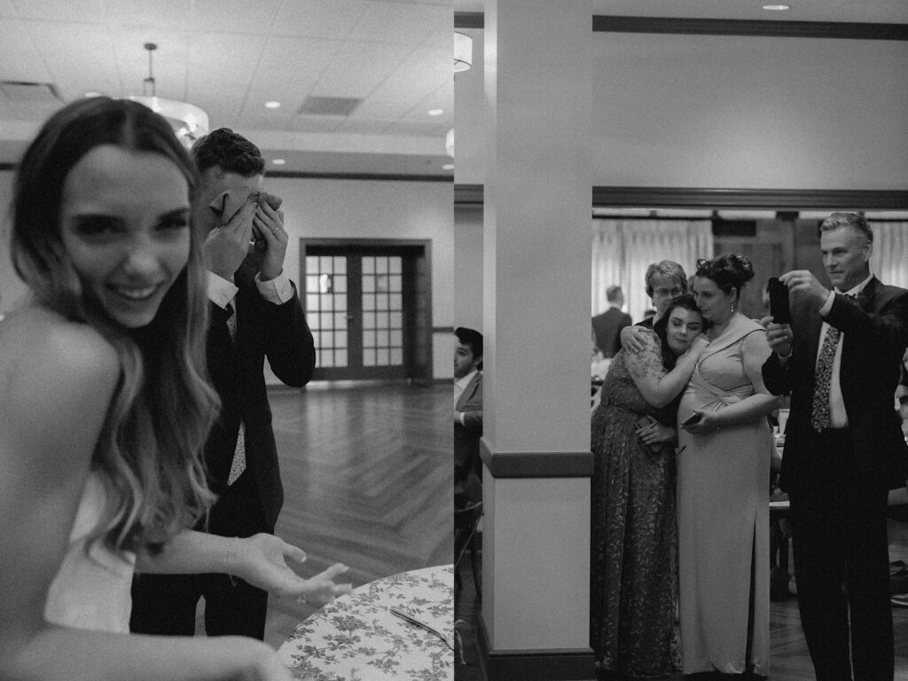 2 black and white photos side by side, the left is of a bride smiling at the camera while the groom wipes cake from his face, the right is of wedding guests watching this happen and taking photos of the moment