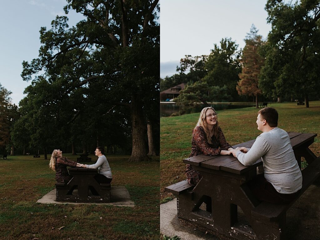 2 photos side by side of a man and woman sitting at a picnic table in a park, the left photo is of the woman laughing as the man sticks his tongue out at her, the right photo is of them smiling while holding hands at the table