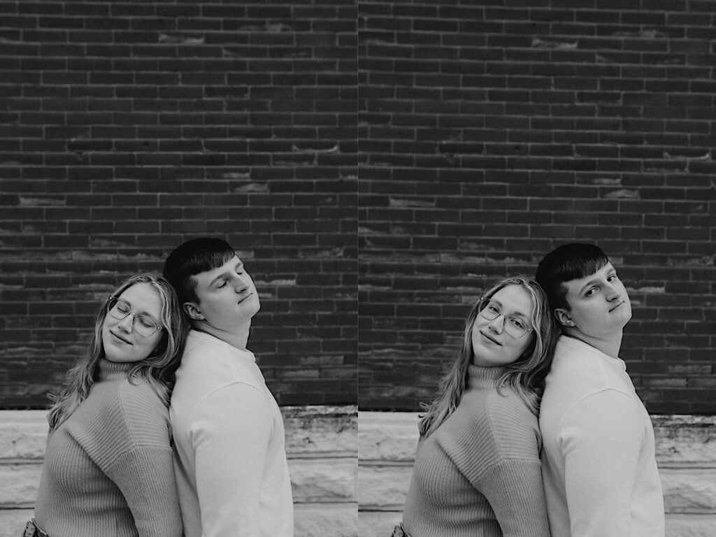 2 black and white photos side by side of a couple standing back to back with one another in front of a brick wall, in the left photo their eyes are closed and in the right photo they are open