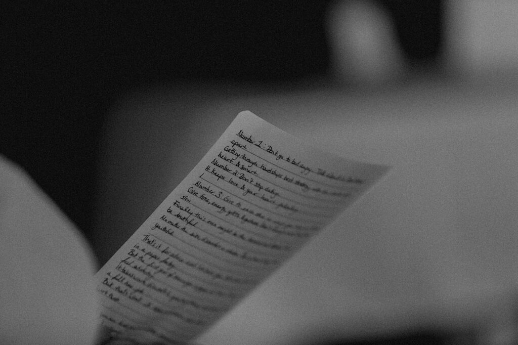 Black and white photo of a speech on a piece of paper being held by someone