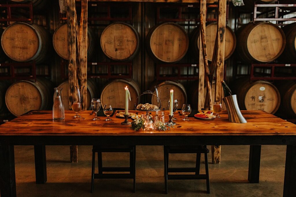 The sweetheart table of an indoor wedding reception at the venue Destihl Brewery, in Bloomington, Illinois