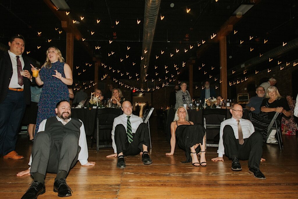 Guests of a wedding dance on the floor with the groom during a wedding reception at Trailside Event Center