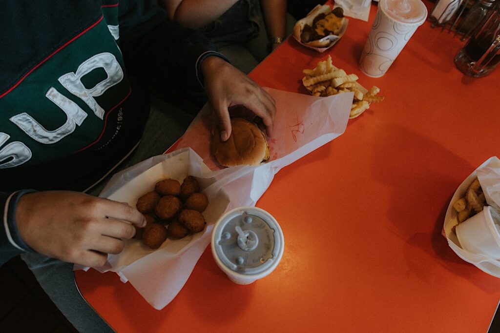 Top down photo of food on a table inside of The Rootbeer Stand 