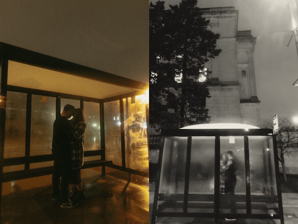 Couple kisses at night at a bus stop at night in the rain.