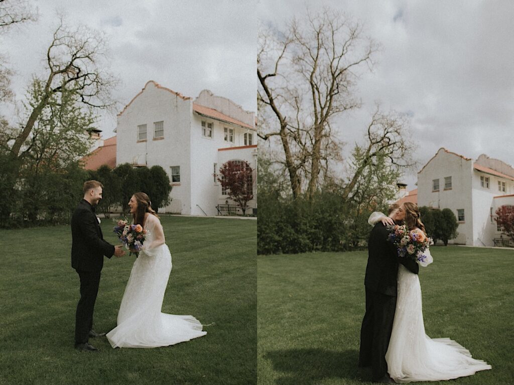 Bride holding colorful floral bouquet hugs groom after first look with Ravisloe Country Club in the distance behind them. 