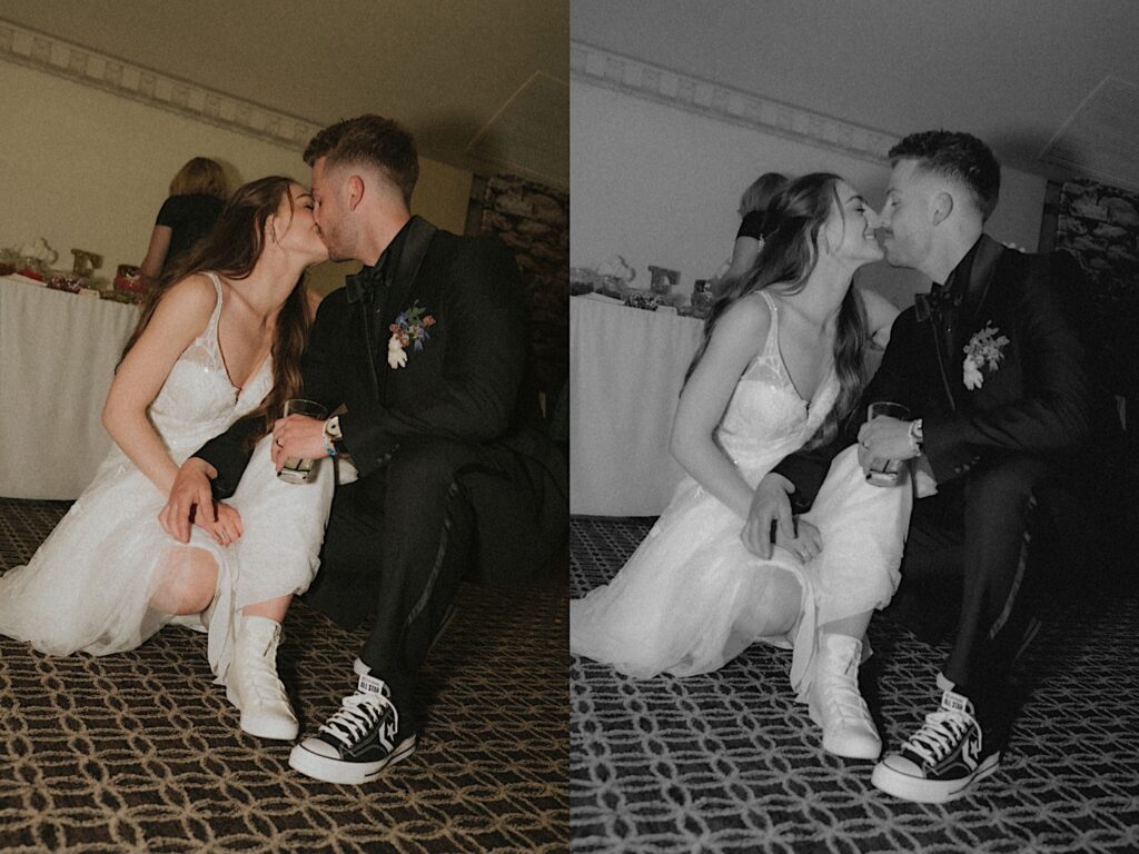 Bride and groom squat down and kiss while they put on matching Chuck Taylor shoes during wedding reception at Ravisloe Country Club. 