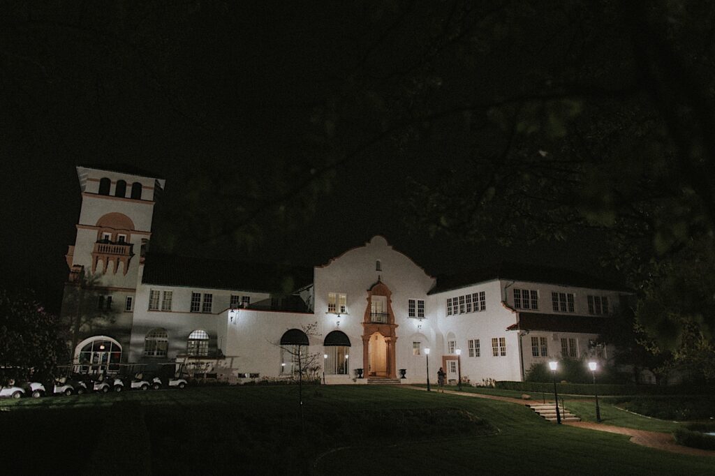 Homewood Wedding photographer captures Ravisloe Country Club at night lit up by street lamps.