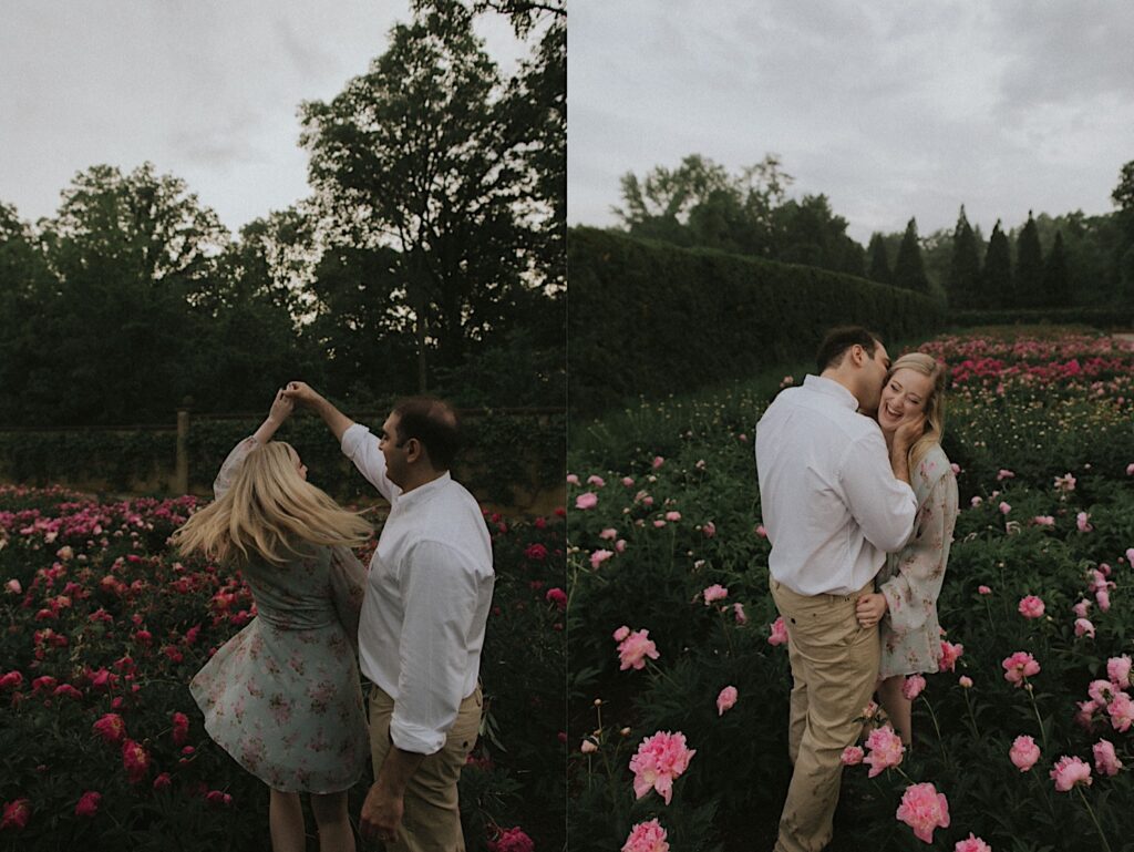 Man spins woman in beautiful garden full of pink flowers in Allerton Park. 