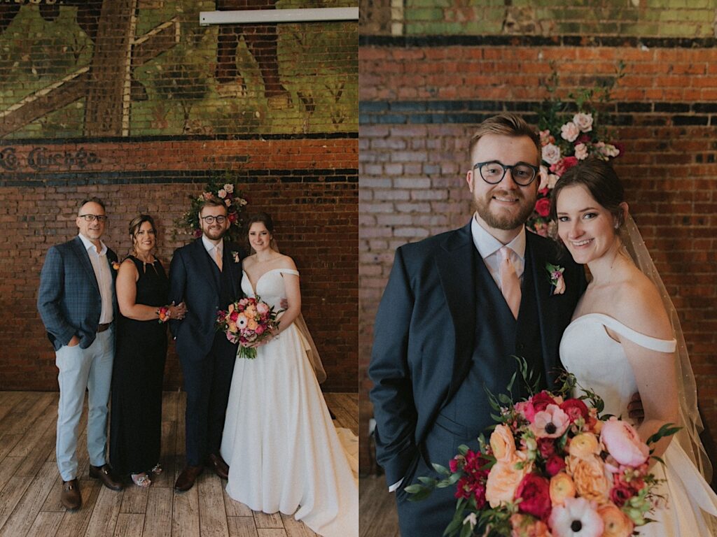 Bride and Groom pose in front of triangle arch holding peach and pink floral bouquet. 