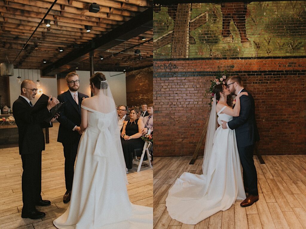 Bride and Groom kiss during wedding ceremony in front of brick wall with green mural painted on it. 