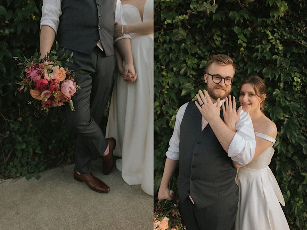 Bride and groom show off their hands with their wedding rings as they pose in front of beautiful ivy covered wall smiling. 