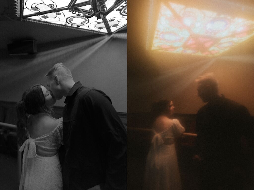 2 photos side by side of a couple standing together under an ornate chandelier in the Virginia Theatre, the left photo is in black and white and features the couple kissing