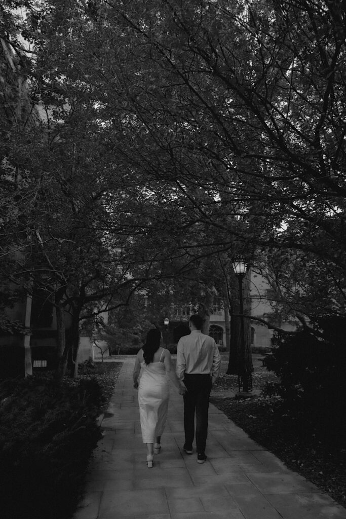 A couple walks together in semi-formal attire during their engagement session with their Chicago wedding photographer