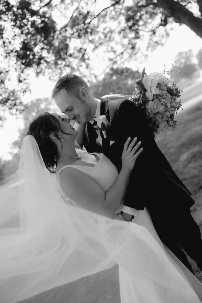 A bride and groom hold one another during their wedding day outside of their wedding venue in the Chicago suburbs. 