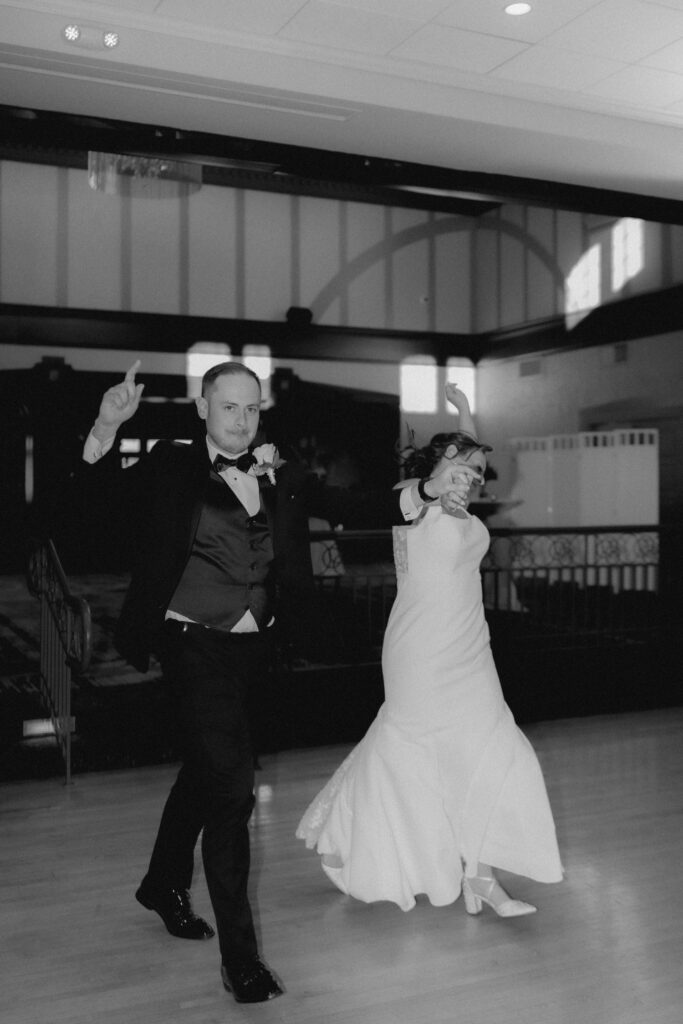 A bride and groom make their grand entrance on their wedding day at the Chevy Chase Country Club. 