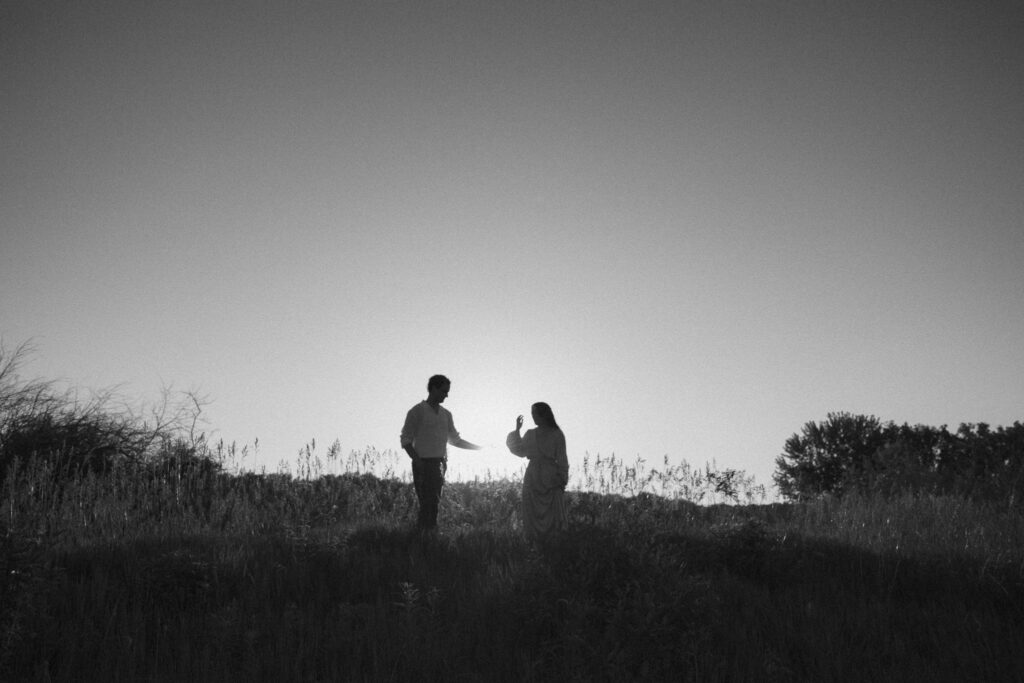 black & white photo of couple during golden hour engagement